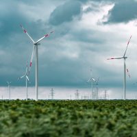 green-energy-concept-with-wind-turbines-in-field-2021-08-31-01-09-43-utc.jpg